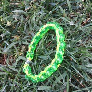 Green sparkle bead with yellow and green stripe